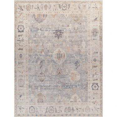 A vintage-inspired Marlene area rug with shades of blue and beige, featuring a floral and geometric pattern.